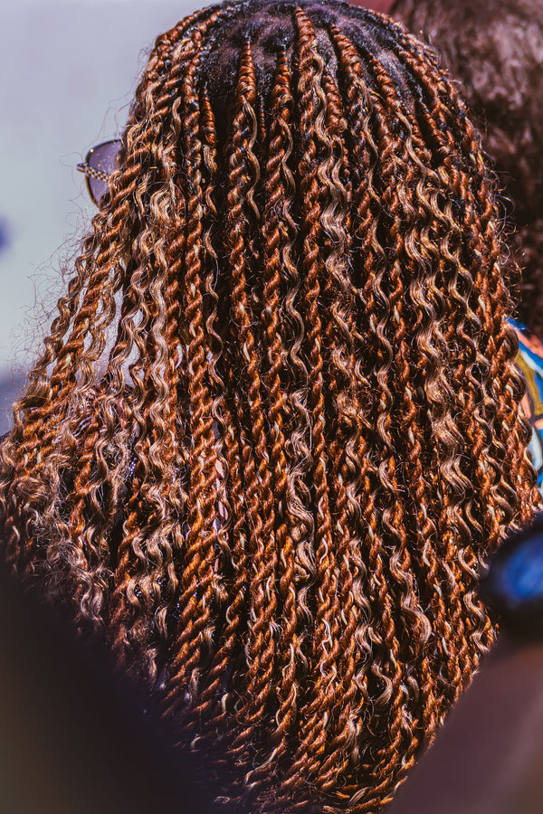 Close-up of textured mini twists, one of the top protective hairstyles trending in 2026